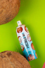(re)FRESH Tropical Coconut Dry Shampoo Spray with a refreshing coconut fragrance, ideal for reviving and volumizing hair.